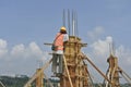 Construction workers fabricating column timber formwork